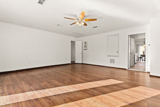 spare room featuring light wood-type flooring, ceiling fan, and ornamental molding