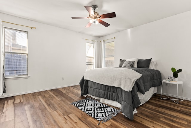 bedroom with ceiling fan and hardwood / wood-style flooring