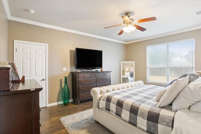 bedroom with dark hardwood / wood-style flooring, crown molding, and ceiling fan