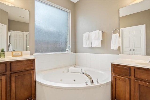 bathroom featuring vanity and a bathing tub