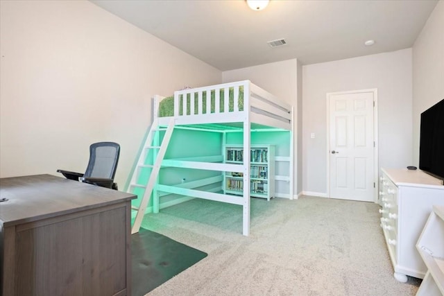 bedroom with light colored carpet