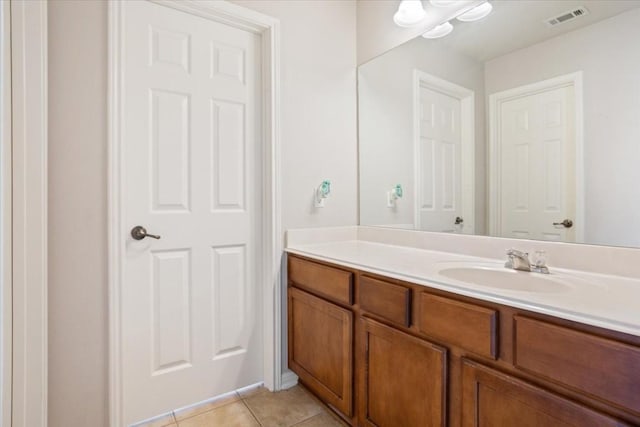 bathroom with tile patterned flooring and vanity