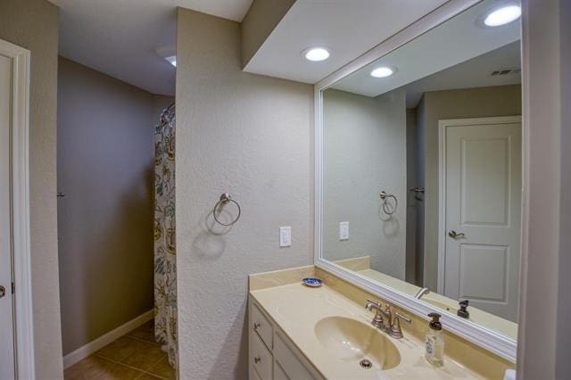 bathroom featuring tile patterned floors and vanity