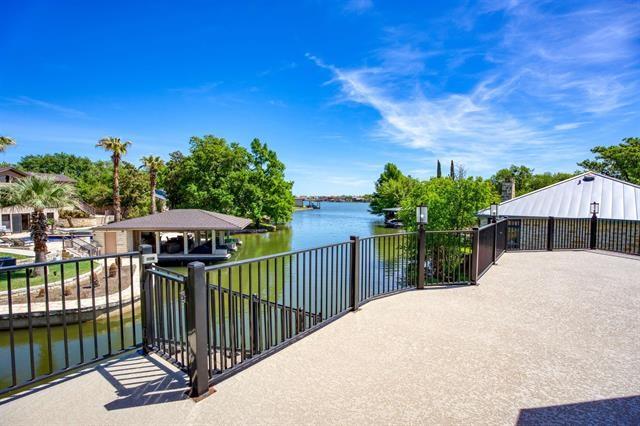 view of patio featuring a gazebo and a water view