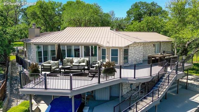 rear view of house with an outdoor living space