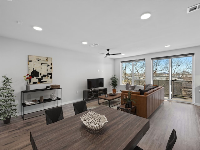 dining area featuring hardwood / wood-style flooring and ceiling fan