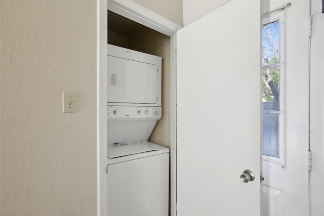 laundry area featuring stacked washing maching and dryer