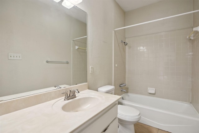 full bathroom with tile patterned floors, vanity, toilet, and tiled shower / bath