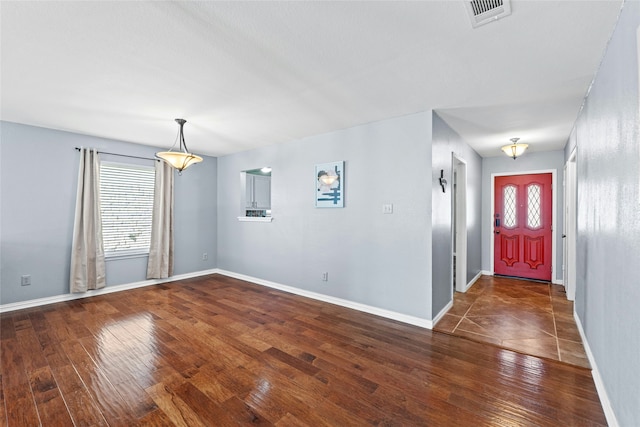 foyer with dark wood-type flooring