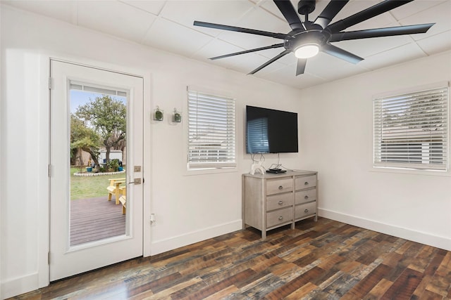 doorway to outside with dark hardwood / wood-style floors and ceiling fan