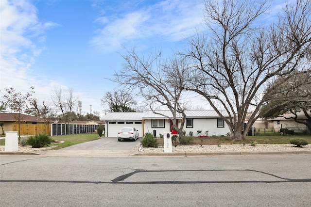 ranch-style home featuring a garage