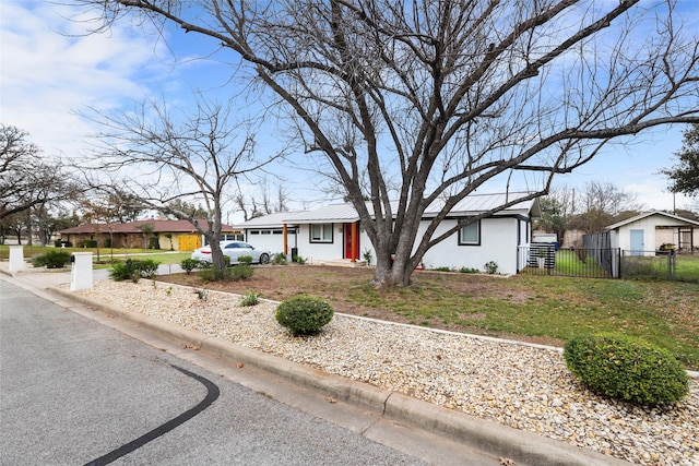 single story home featuring a garage