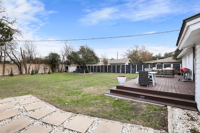 view of yard with an outdoor living space and a deck