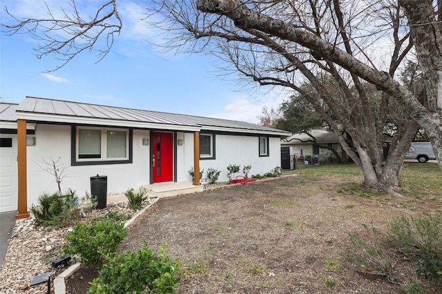 ranch-style house featuring a garage