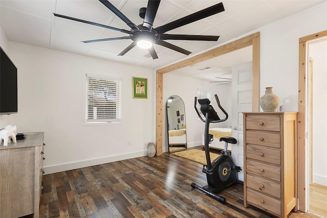 workout area featuring dark wood-type flooring