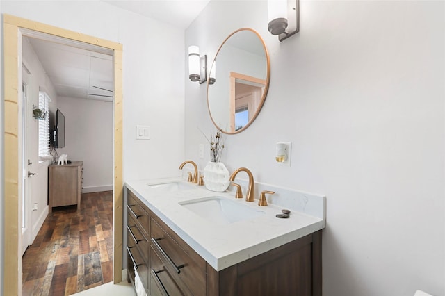 bathroom with hardwood / wood-style floors and vanity