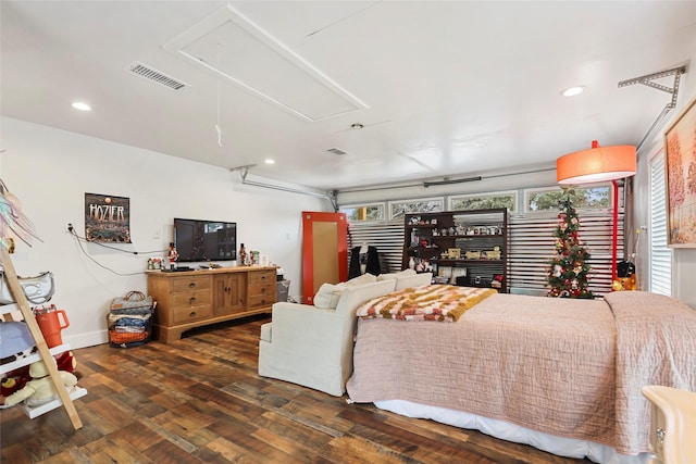 bedroom with dark hardwood / wood-style floors