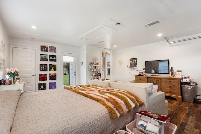 bedroom with dark hardwood / wood-style floors