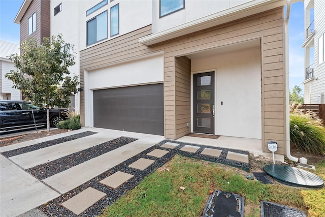 view of exterior entry featuring a garage