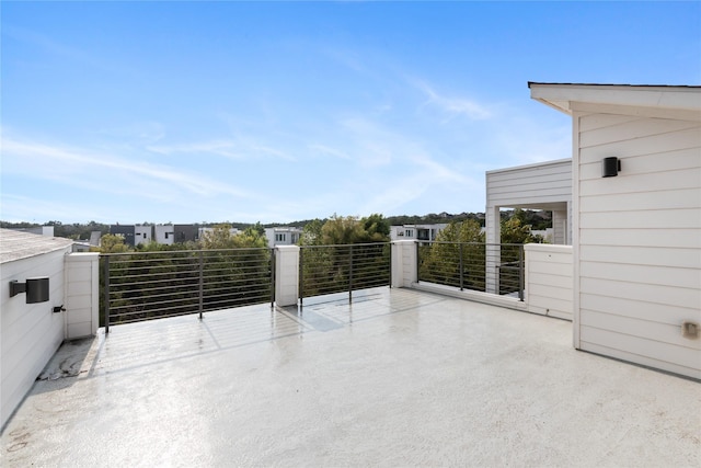 view of patio featuring a balcony