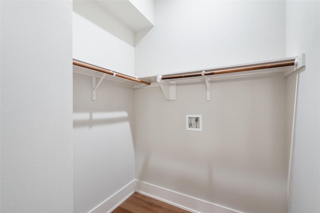 laundry area featuring hookup for a washing machine and hardwood / wood-style floors