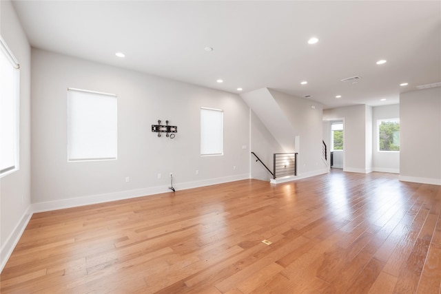 unfurnished living room with light wood-type flooring