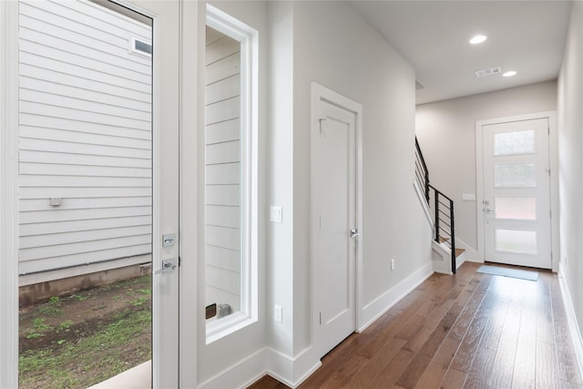 foyer entrance with dark hardwood / wood-style flooring