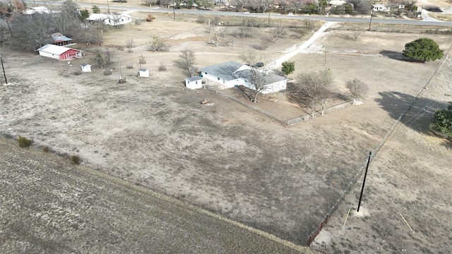 birds eye view of property with a rural view