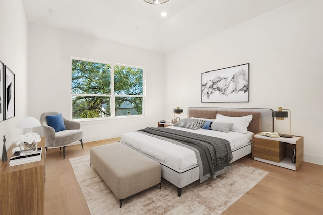 bedroom with light hardwood / wood-style flooring