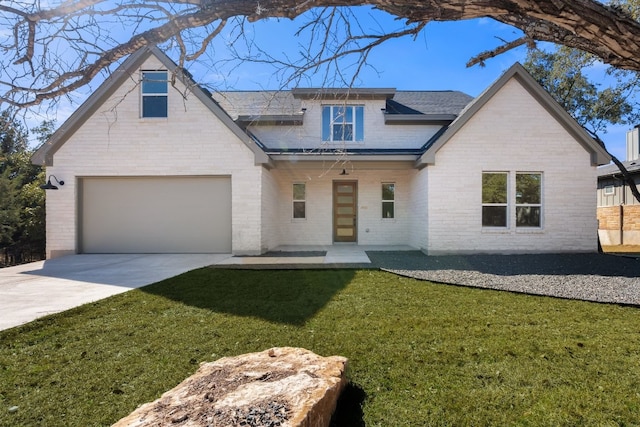 view of front of home with a garage and a front lawn