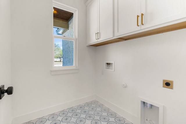 laundry room featuring cabinets, hookup for a washing machine, and hookup for an electric dryer