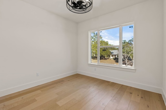 spare room with hardwood / wood-style floors