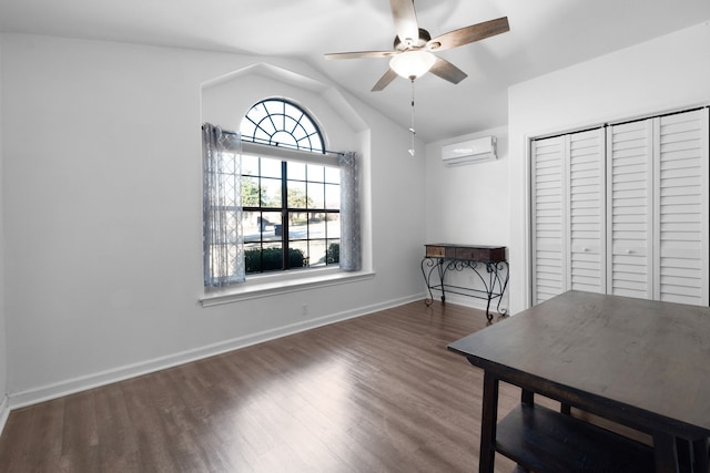 interior space featuring a wall mounted air conditioner, dark hardwood / wood-style flooring, ceiling fan, and lofted ceiling