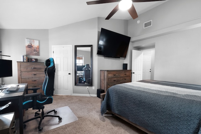 carpeted bedroom with ceiling fan and lofted ceiling