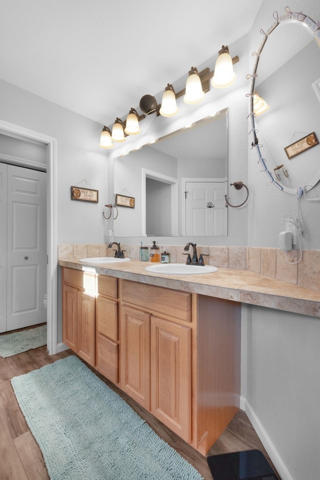 bathroom featuring vanity and wood-type flooring