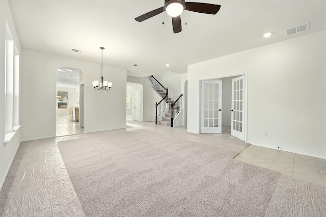 unfurnished living room with ceiling fan and light tile patterned flooring