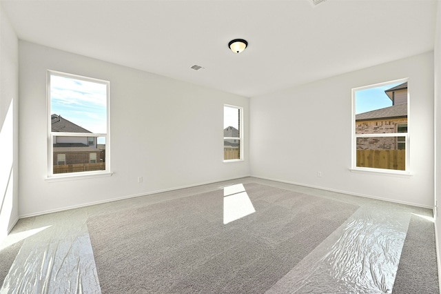 empty room featuring a wealth of natural light