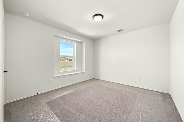 view of carpeted spare room