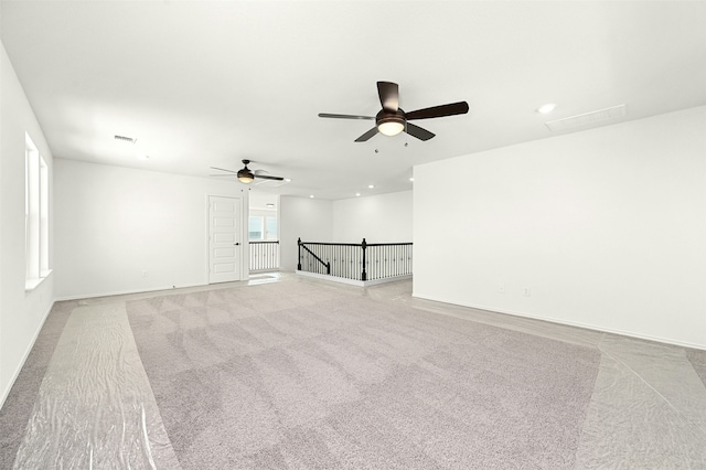 carpeted empty room with ceiling fan