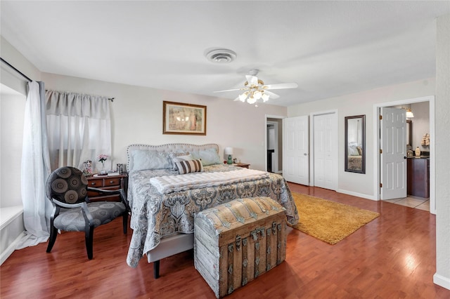 bedroom with hardwood / wood-style floors and ceiling fan