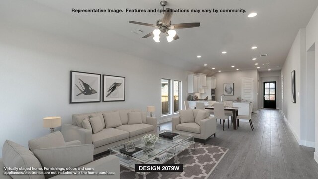 120 King Haakon Bay Dr, Kyle, TX 78640 - living room featuring a ceiling fan, recessed lighting, and light wood-type flooring