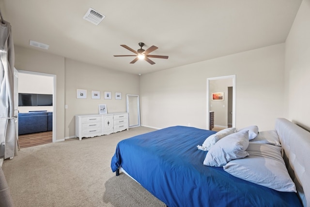 bedroom featuring carpet flooring, connected bathroom, and ceiling fan