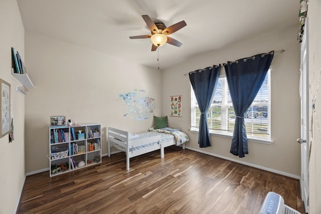 bedroom featuring dark wood-type flooring and ceiling fan