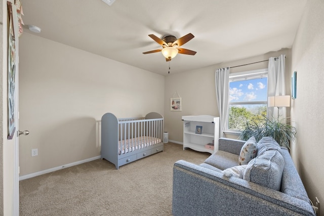 carpeted bedroom featuring ceiling fan