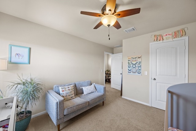 interior space featuring light carpet and ceiling fan