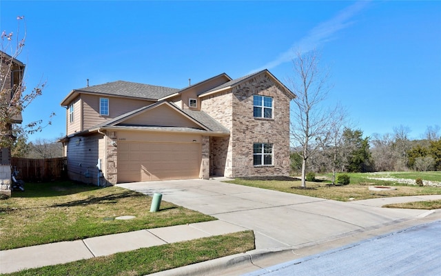 view of front of home with a garage and a front yard