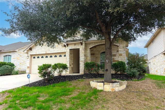 ranch-style house with a front yard and a garage