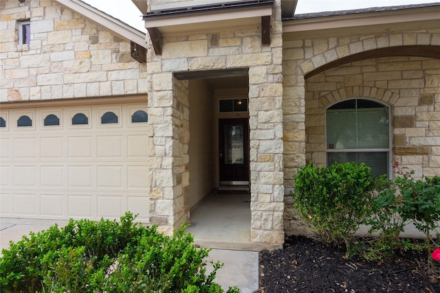 entrance to property featuring a garage