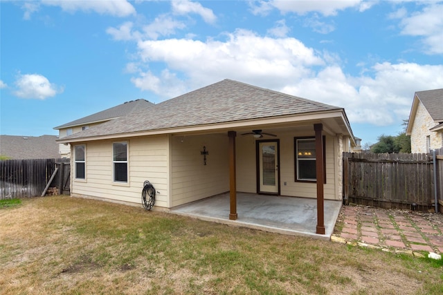 back of house with a lawn, a patio area, and ceiling fan