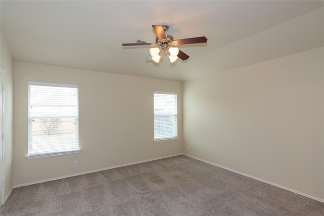 spare room with ceiling fan and light colored carpet